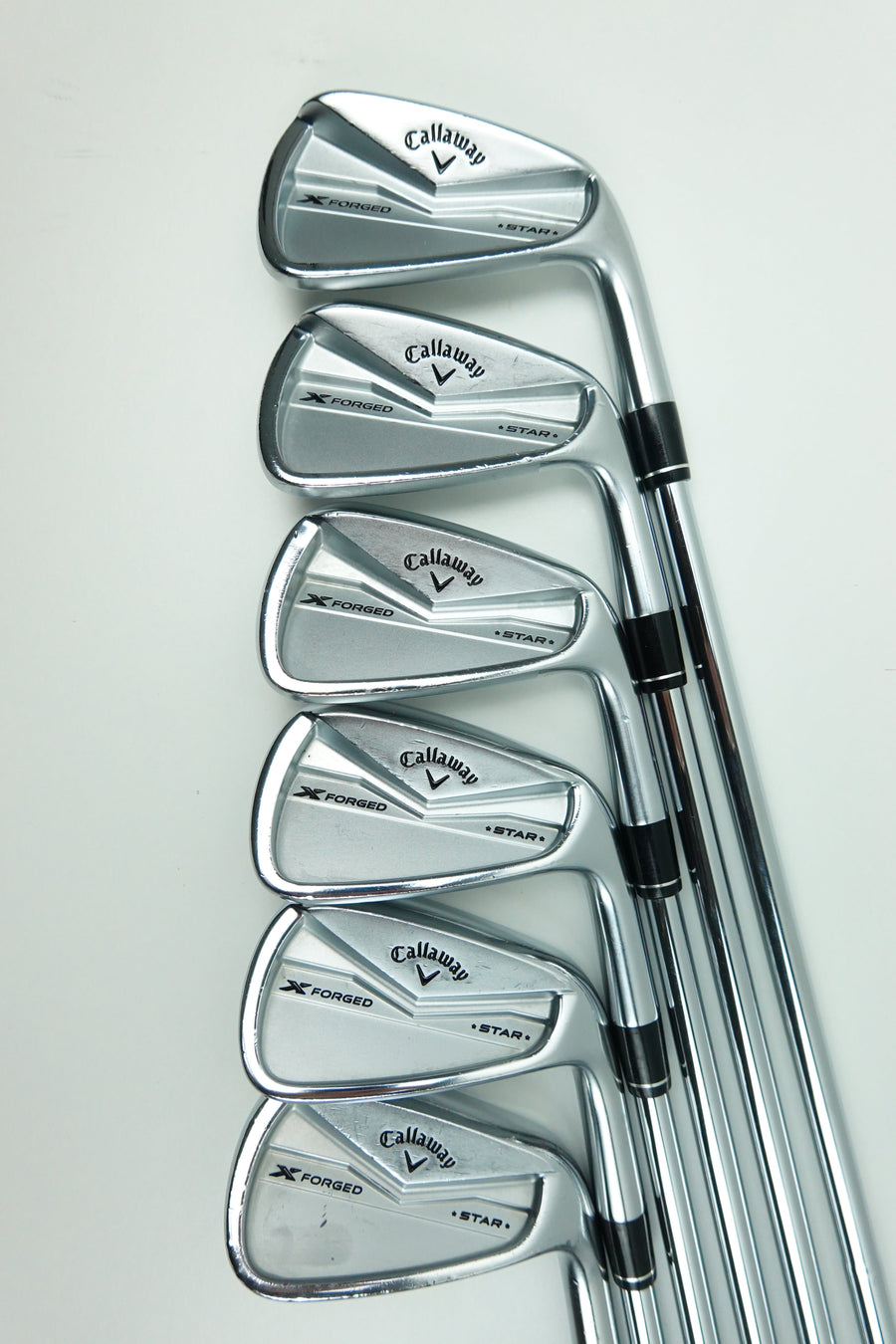 A set of five Callaway iron golf clubs arranged in a fan shape on a plain white background.