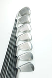 A set of eight golf iron clubs with silver metal heads and black shafts, arranged in a neat diagonal row on a clean white background.